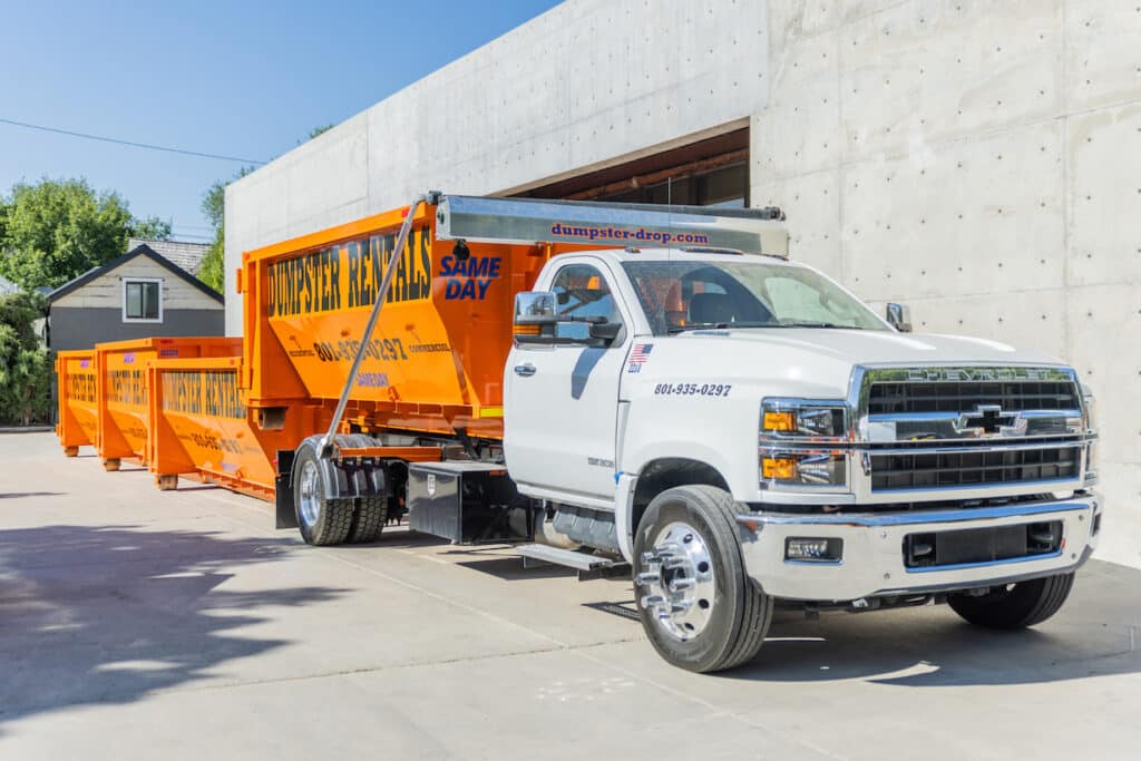A Chevrolet salt dumpster parked in front of a building.