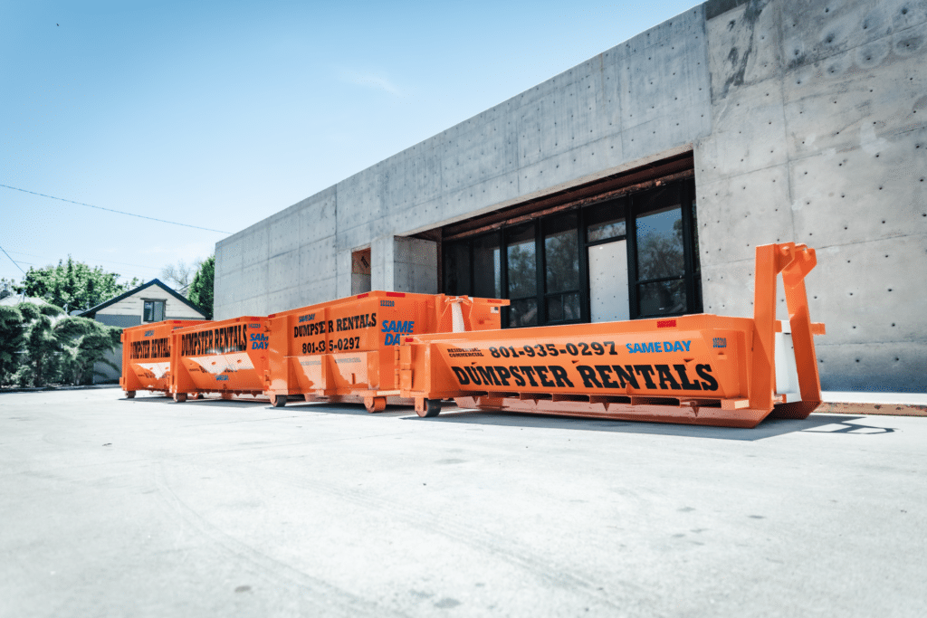 A group of orange dumpster rentals parked in front of a building.
Keywords: Dumpster Rental, Dumpster Rental Salt Lake