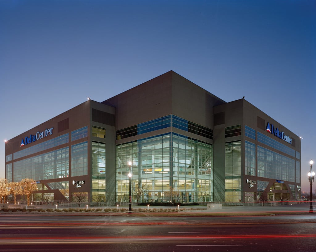 A Sameday Dumpster Rental with a glass facade at dusk.