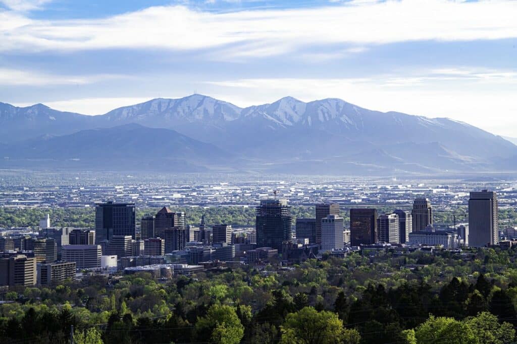 A city skyline with mountains in the background, featuring stunning views of Salt Lake City.